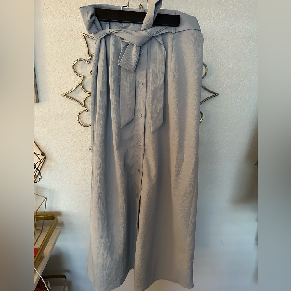 Right above button down skirt